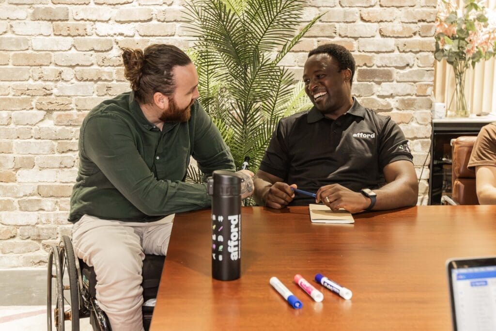 A support worker and SIL client having a chat.